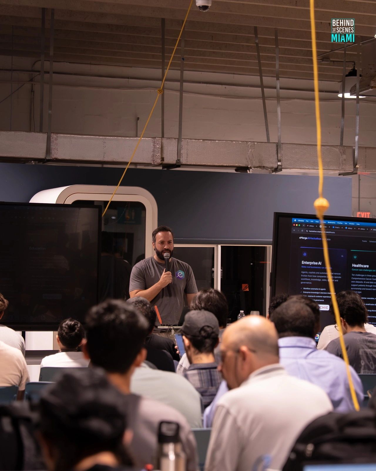 A full house leans in: the hackathon floor at the Miami AI Summit.