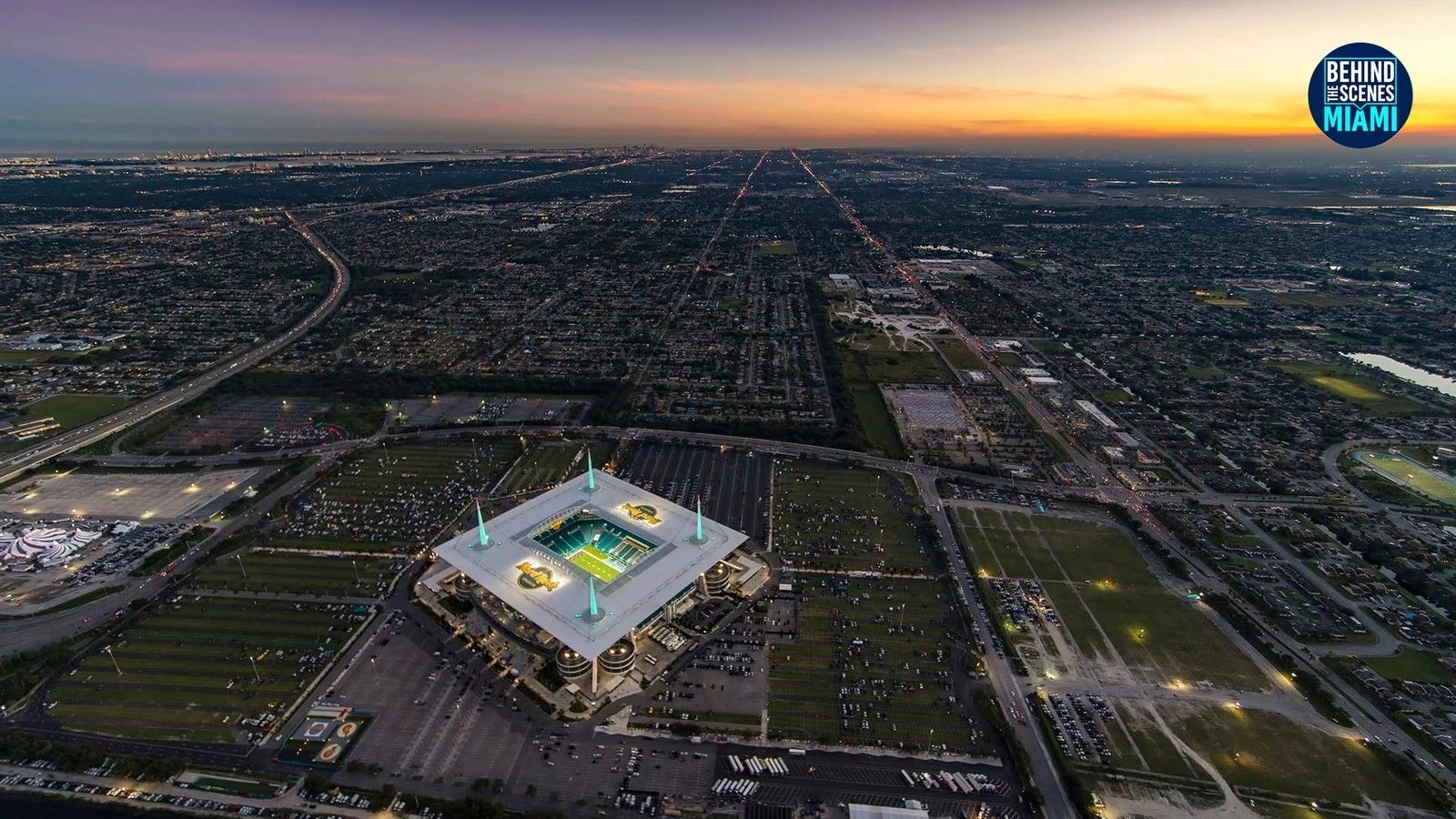 Dusk settles over Hard Rock Stadium, and the whole city glows with it.